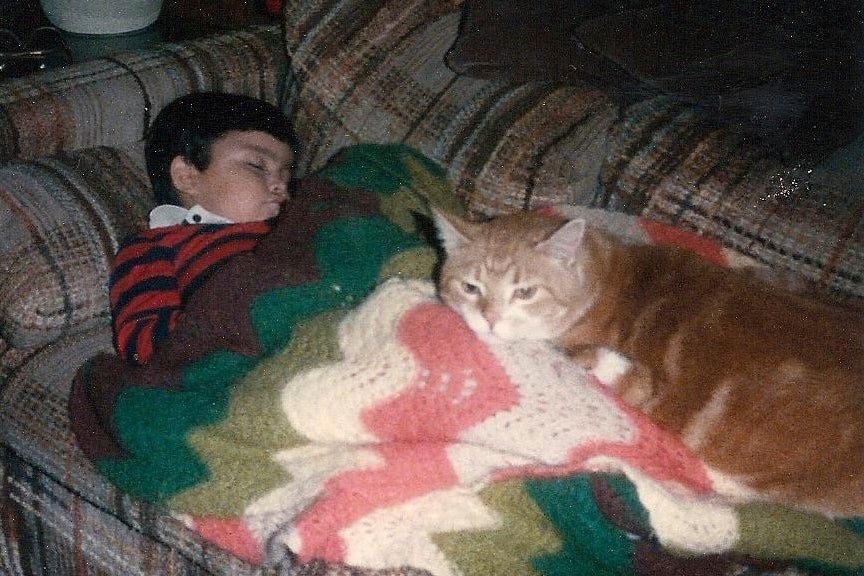 Jimmy Thyden as a child with cat Rusty.