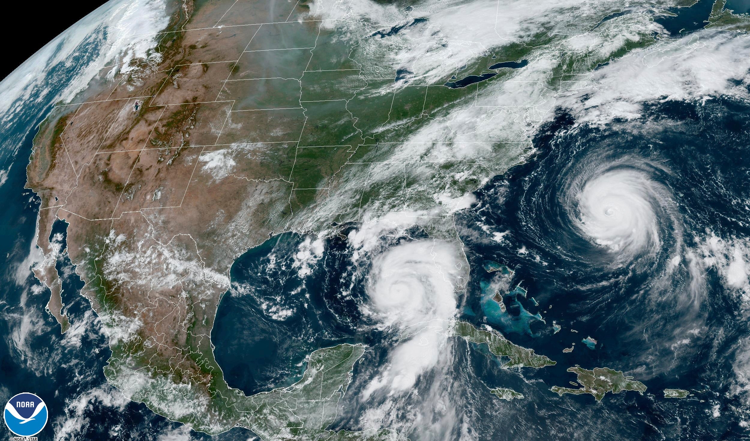 This Tuesday, Aug. 29, 2023, 1:31 p.m. EDT satellite image provided by the National Oceanic and Atmospheric Administration shows Hurricane Idalia, center, approaching Florida's Gulf Coast, and Hurricane Franklin, right, as it moves along the East Coast of the United States, southwest of Bermuda.