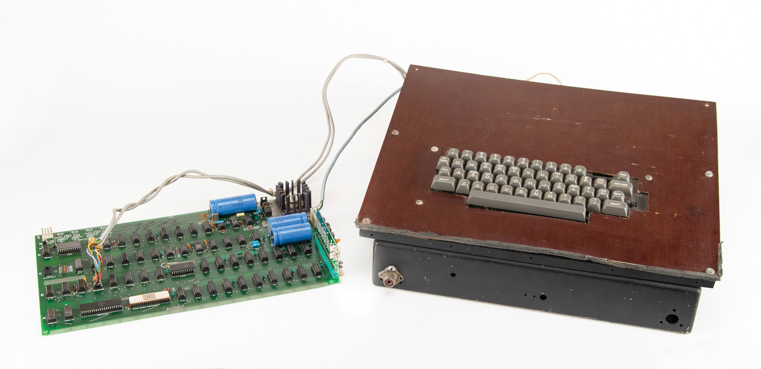 A vintage Apple computer built in the 1970s and signed by company co-founder Steve Wozniak.