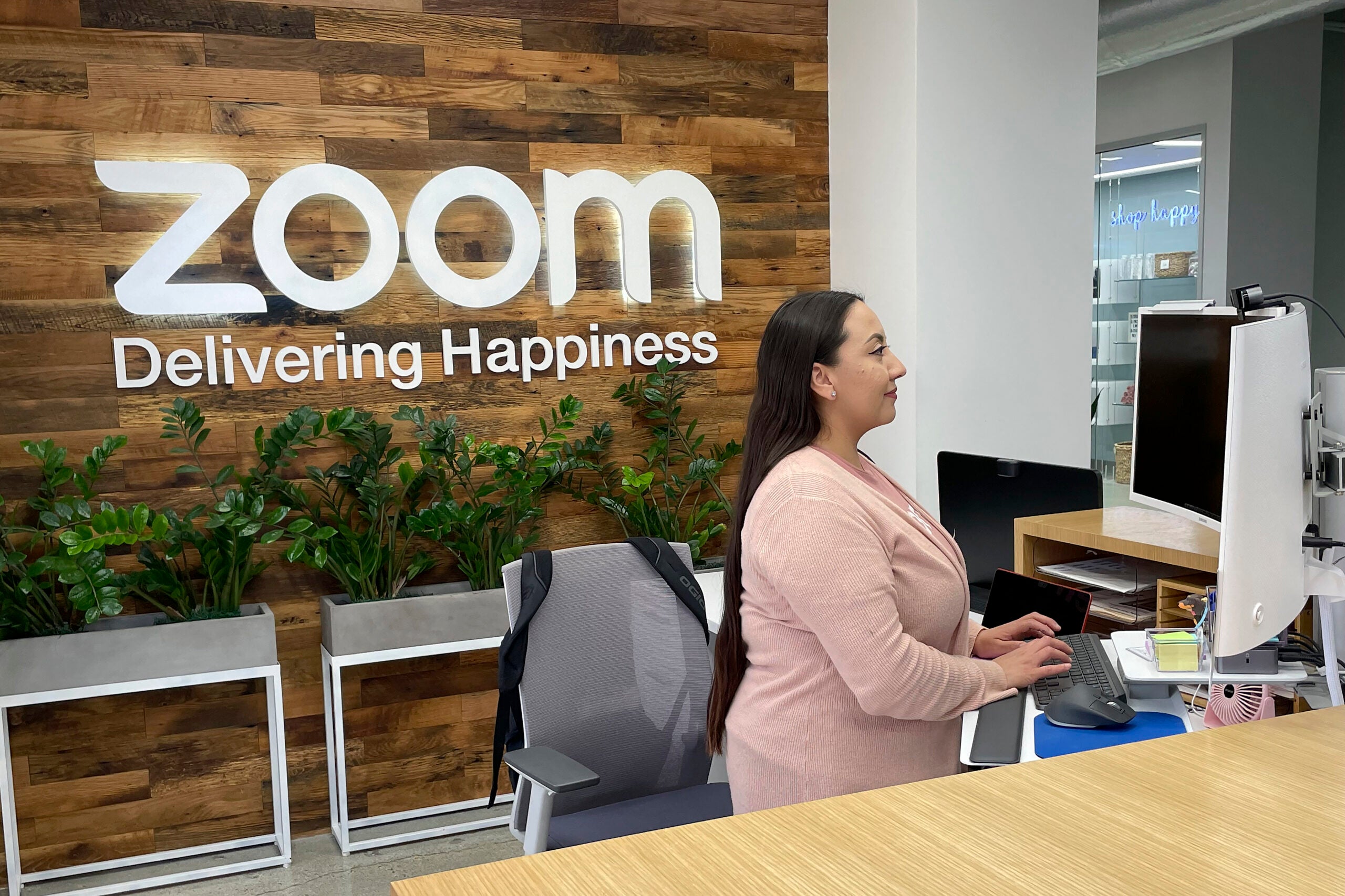 A woman works at Zoom headquarters.