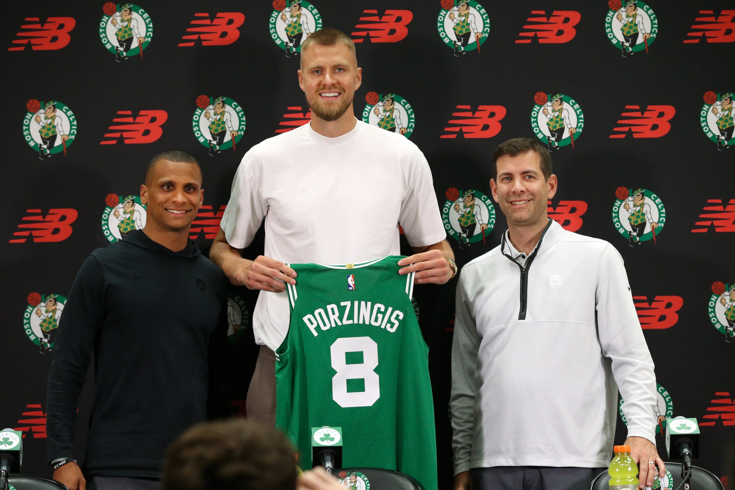 Boston Celtics head coach Joe Mazzulla (cq) left with Newly acquired big man Kristaps Porzingis(cq) middle and Brad Stevens (cq) right President of basketball operations , at a afternoon press-conference with their new player. They were all smiles during the presentation to Kristaps of his new Celtics Jersey.