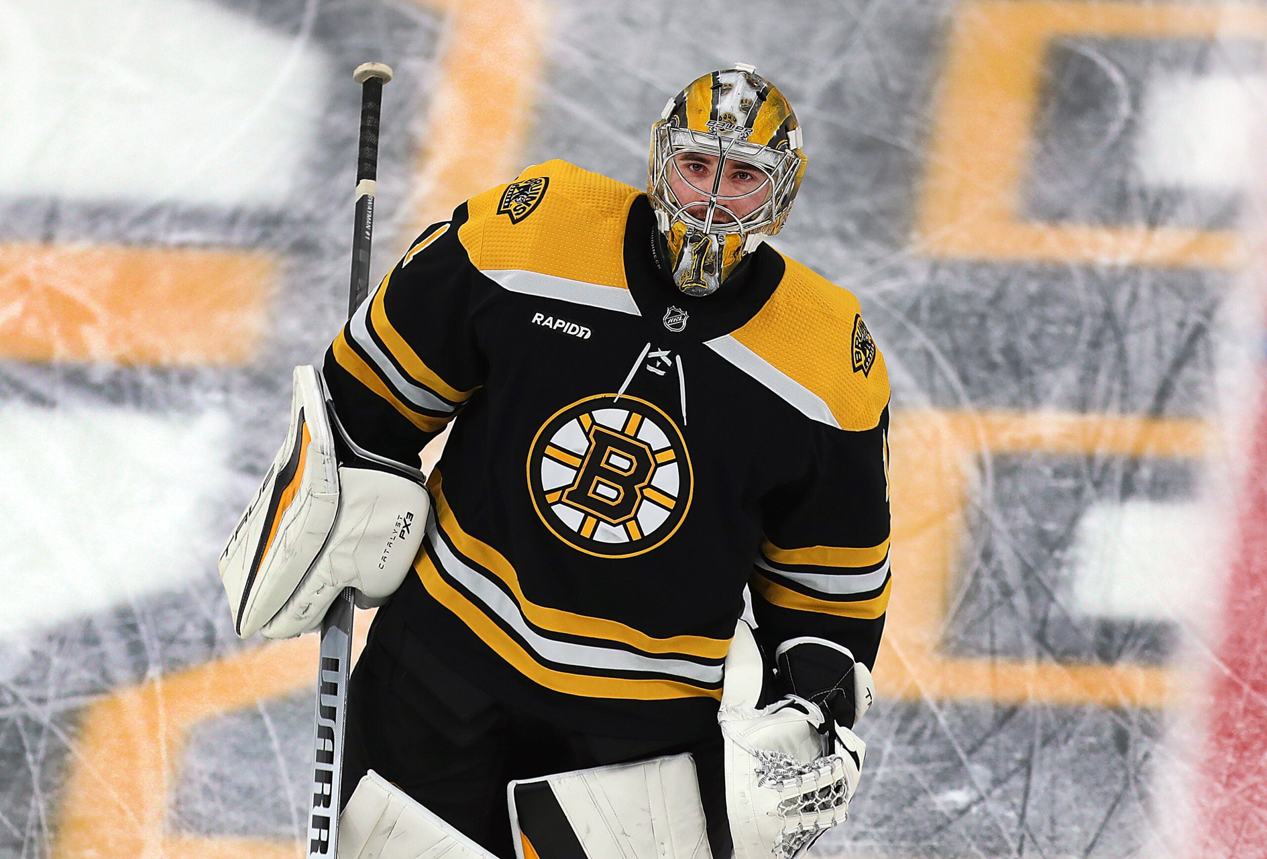 Boston Bruins goaltender Jeremy Swayman (1) skates on the ice in pregame warmups.
