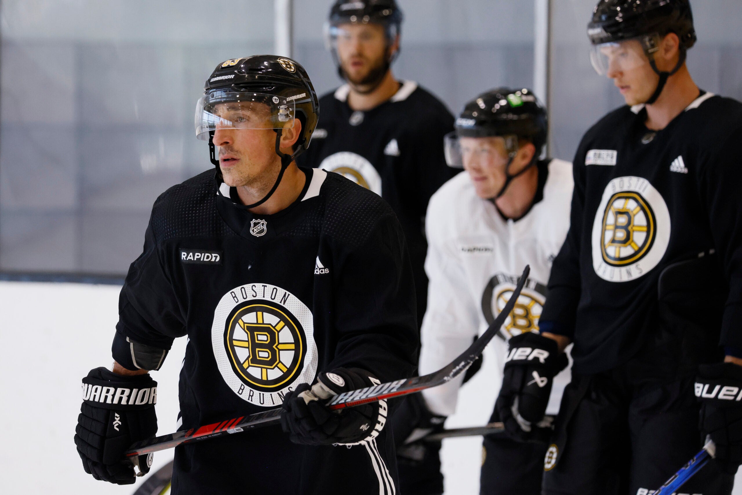 Brad Marchand runs through a drill during Bruins captain’s practice at Warrior Arena.