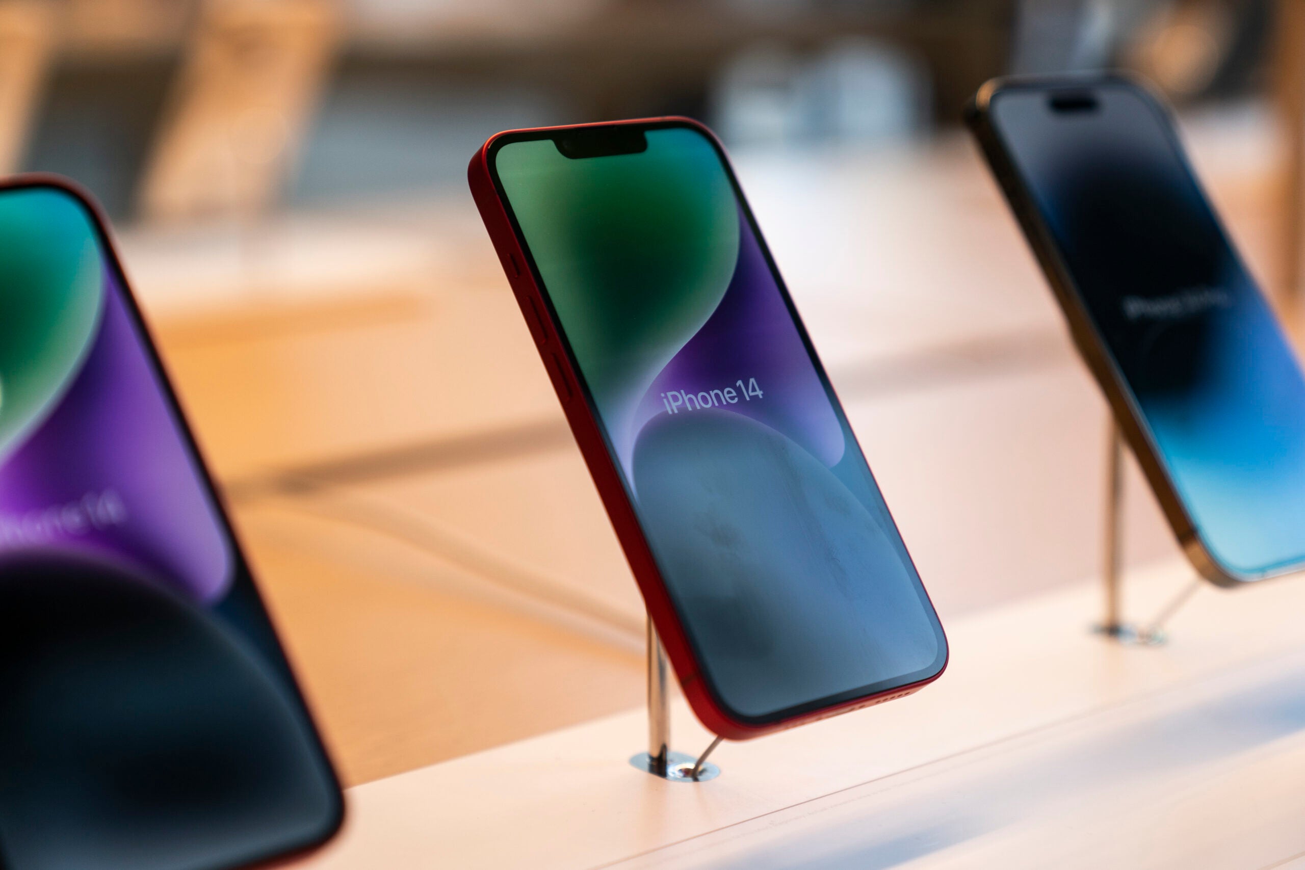 Apple iPhone 14 phones sit on display.