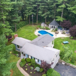 Overview of home in Lynnfield featuring a pool, and cabana.