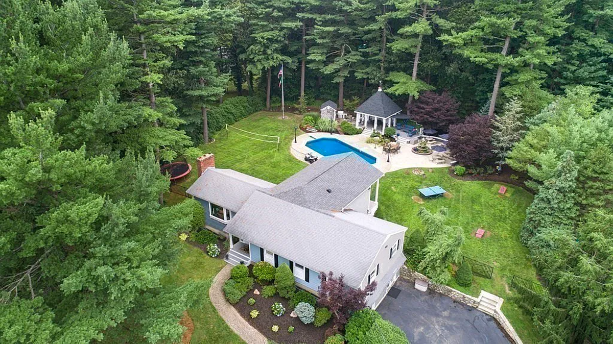 Overview of home in Lynnfield featuring a pool, and cabana.