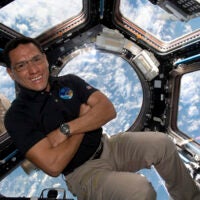 Astronaut Frank Rubio floating inside the cupola, the International Space Station’s “window to the world.”