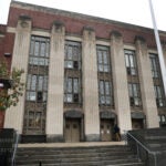 A picture of the front of Jeremiah Burke High School in Dorchester.
